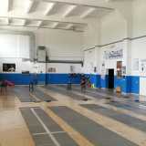 L'atleta si allena nell'Arena della vittoria. La sala in cui si svolge il suo addestramento accoglie dieci pedane: i terreni di gioco sui quali si consumano i duelli